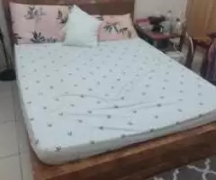 Queen bed with side table